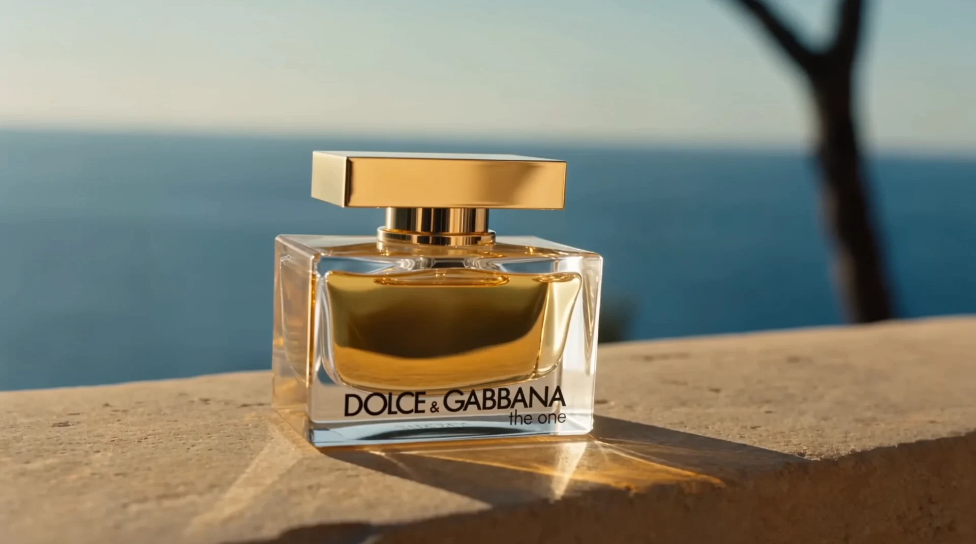 The One fragrance bottle overlooking the sea