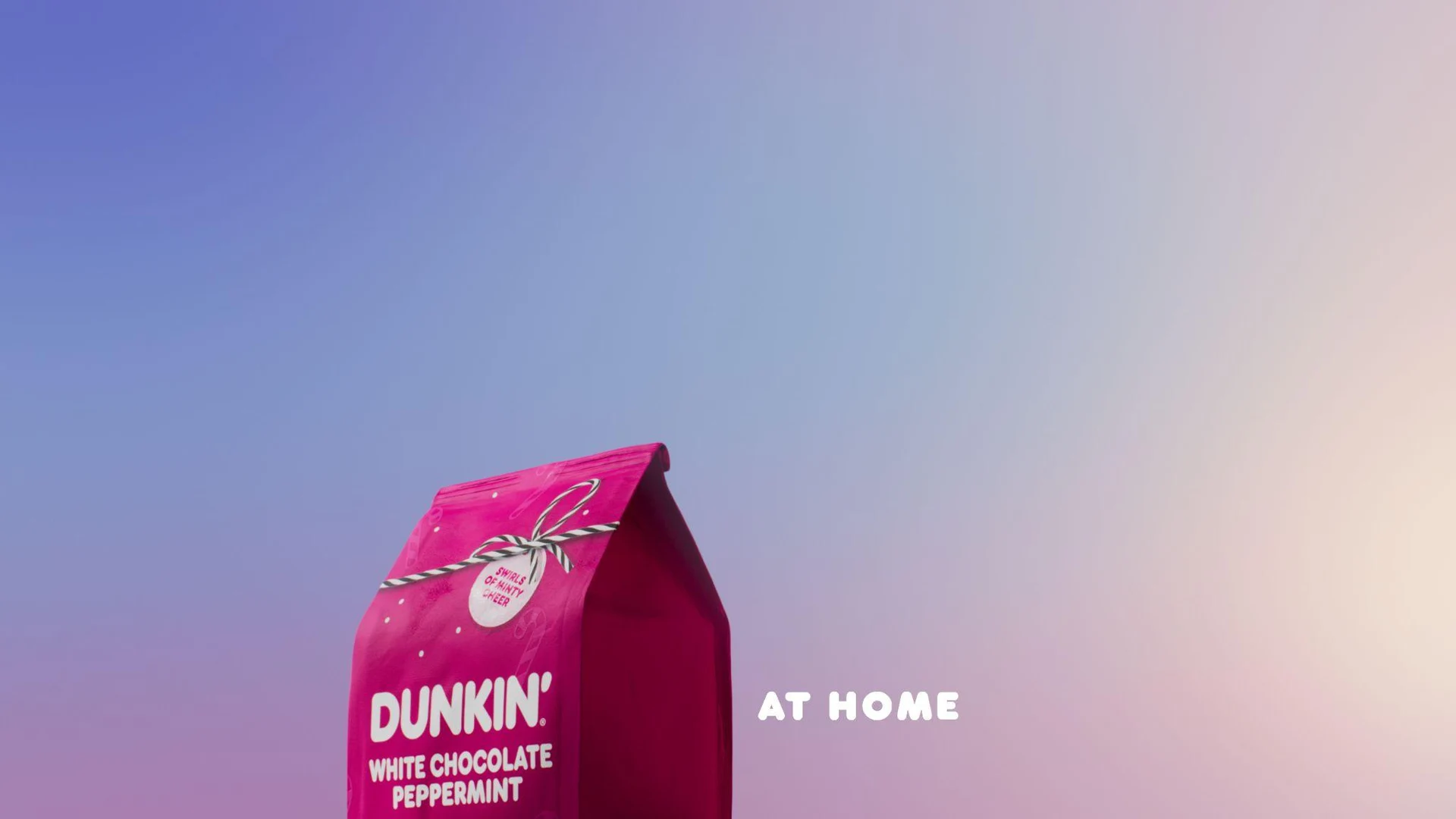 White Chocolate Peppermint coffee pack against a pink and lavender gradient